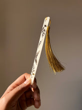 Load image into Gallery viewer, Aesthetic resin bookmark with natural botanical design and gold tassel, handmade for nature lovers.