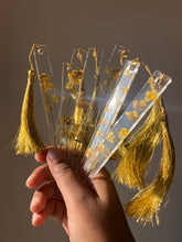 Load image into Gallery viewer, Handmade resin bookmark with preserved mustard flowers and golden tassel by ShopKuhoo.