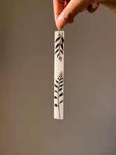 Load image into Gallery viewer, Eco-conscious resin bookmark with real botanical leaves and gold tassel, a nature-inspired handmade gift