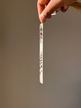 Load image into Gallery viewer, Pressed botanical leaf bookmark in resin with gold tassel, ideal for minimalistic and nature-themed gifts.