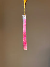 Load image into Gallery viewer, Eco-friendly resin bookmark with real pink Bougainvillea petals and golden tassel, displayed on a beautifully open book
